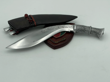 Historical Gurkha kukri knife with brass handle and pinewood-lined leather sheath
